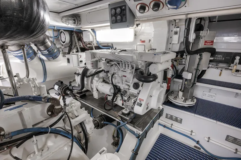 Slide: The Image of Engine room of a 1997 Merritt 58 yacht, showcasing mechanical components and gauges. - 57