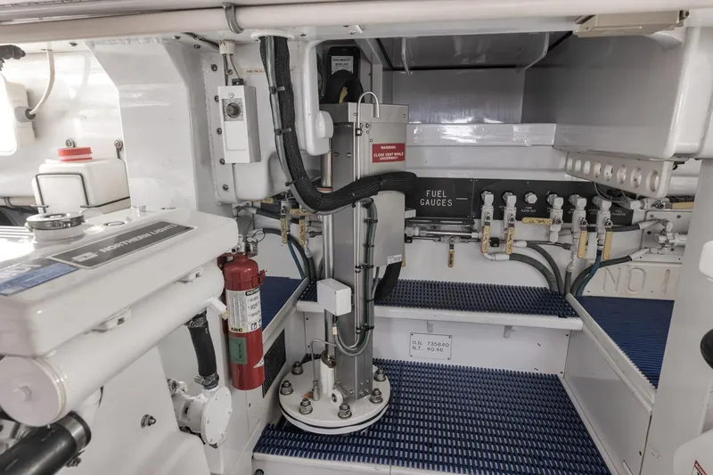 Slide: The Image of Engine room of 1997 Merritt 58 yacht with fuel gauges and fire extinguisher. - 60