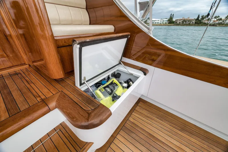 Slide: The Image of Luxurious 1997 Merritt 58 yacht with open storage compartment and elegant wooden deck. - 67