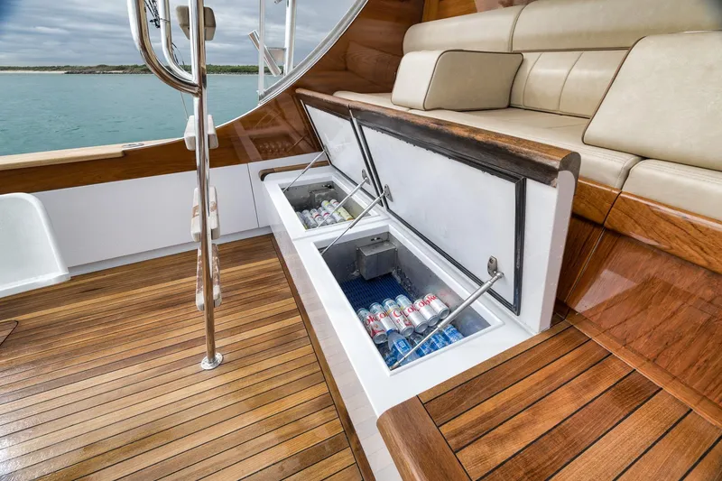 Slide: The Image of Luxurious 1997 Merritt 58 yacht with open deck storage and cushioned seating. - 69