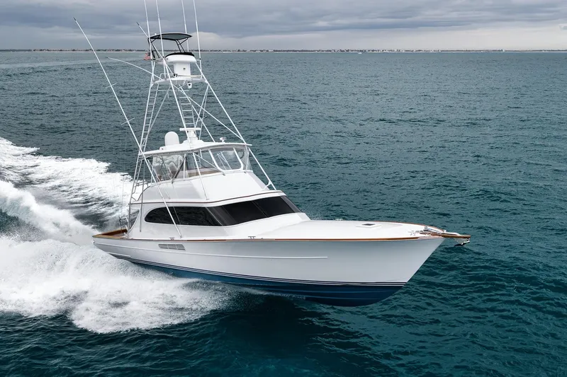 Slide: The Image of 1997 Merritt 58 yacht cruising on open sea under cloudy skies. - 7