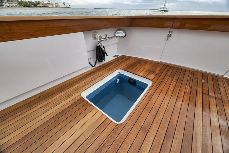 Slide: The Image of Teak deck of 1997 Merritt 58 yacht with open hatch, ocean view. - 83