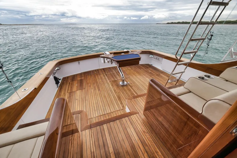 Slide: The Image of Luxurious 1997 Merritt 58 yacht deck with wooden flooring and ocean view. - 85