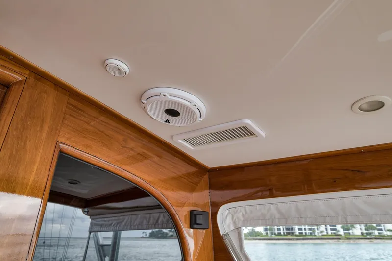 Slide: The Image of Ceiling view inside 1997 Merritt 58 yacht, featuring wood paneling and ventilation system. - 95