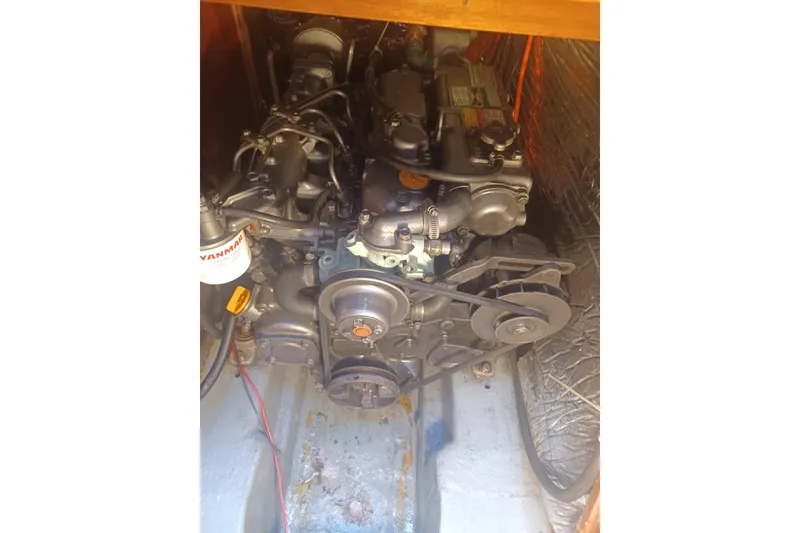 Slide: The Image of Engine compartment of a 1987 O'Day 40 sailboat, featuring a Yanmar engine. - 22