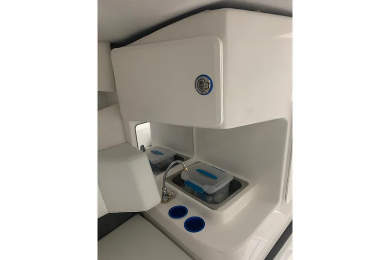 Slide: The Image of 2008 Sunsation 32 Mid-Cabin interior with sink, storage, and modern design elements. - 11