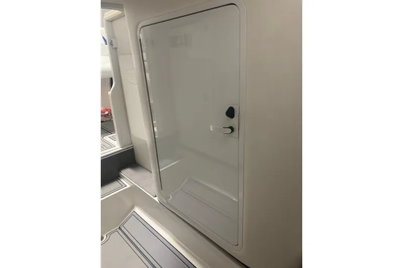 Slide: The Image of 2008 Sunsation 32 Mid-Cabin interior with sleek white door and modern design. - 12