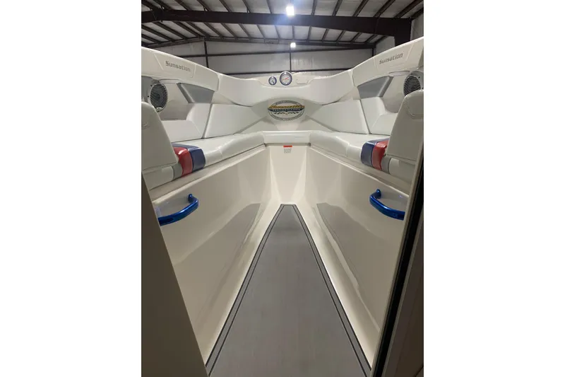 Slide: The Image of 2008 Sunsation 32 Mid-Cabin boat interior with sleek white seating and modern design. - 15