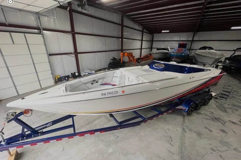 Slide: The Image of 2008 Sunsation 32 Mid-Cabin boat on trailer in storage facility. - 17