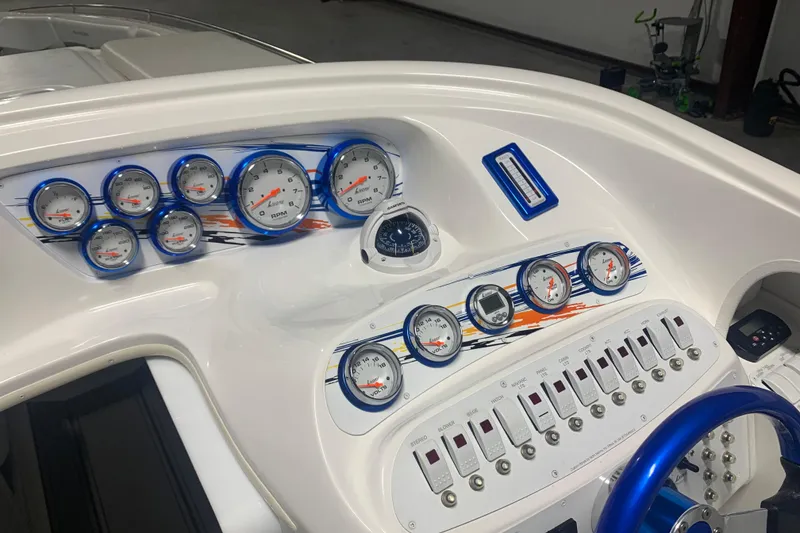 Slide: The Image of Dashboard of 2008 Sunsation 32 Mid-Cabin boat with gauges and controls. - 5