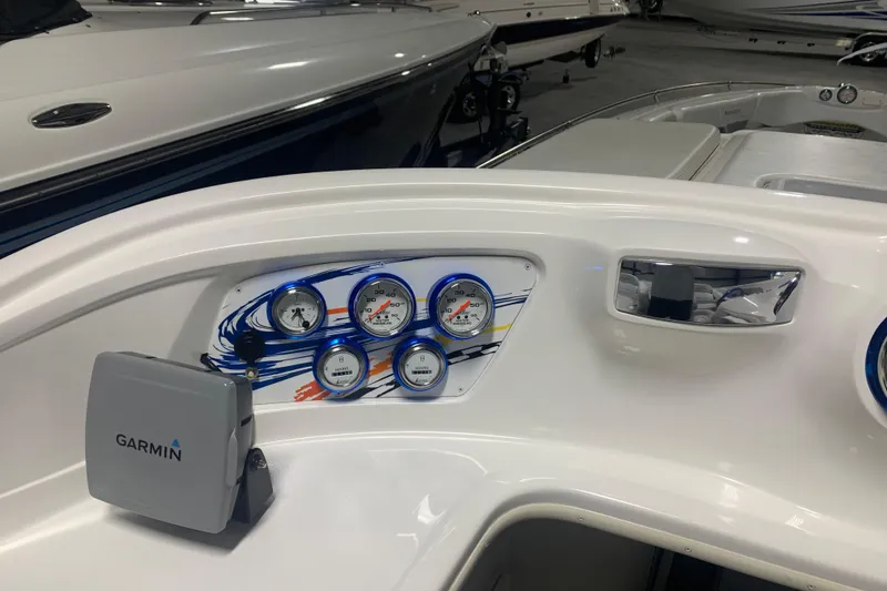 Slide: The Image of 2008 Sunsation 32 Mid-Cabin boat dashboard with Garmin GPS and colorful gauges. - 6