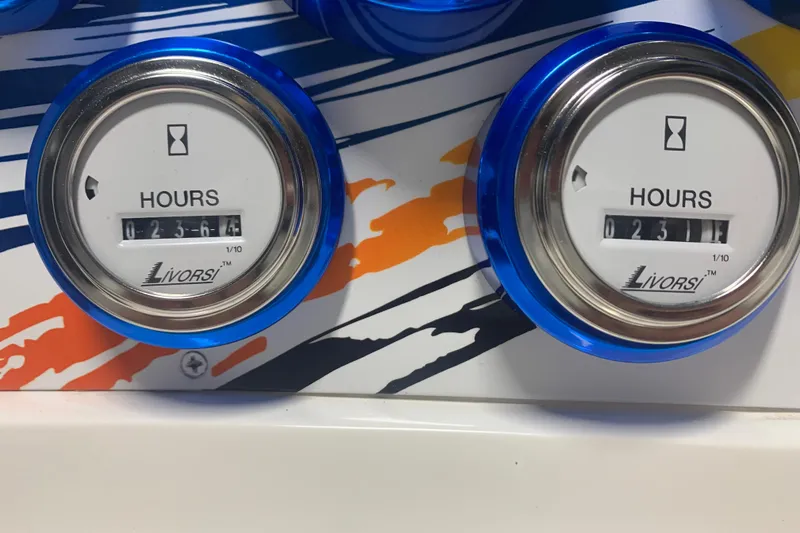 Slide: The Image of Hour meters on a 2008 Sunsation 32 Mid-Cabin boat dashboard, showing usage hours. - 9