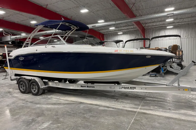 The Image of 2012 Cobalt 276 boat on trailer in indoor storage facility. - 1