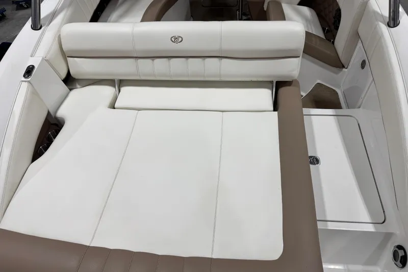 Slide: The Image of 2012 Cobalt 276 boat interior with white and brown seating. - 11