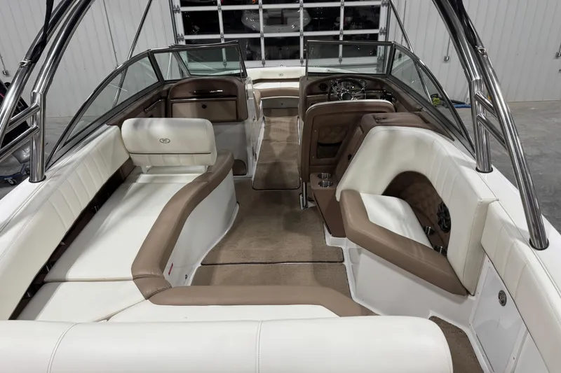 Slide: The Image of Interior of a 2012 Cobalt 276 boat with beige and white seating. - 6