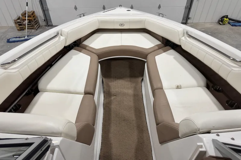 Slide: The Image of Interior of a 2012 Cobalt 276 boat with beige and white seating. - 9