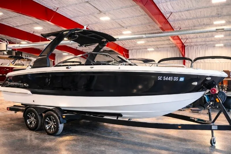 The Image of 2019 Chaparral 257 SSX boat on trailer in indoor showroom. - 0