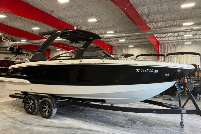 Slide: The Image of 2019 Chaparral 257 SSX boat on trailer in indoor showroom. - 2