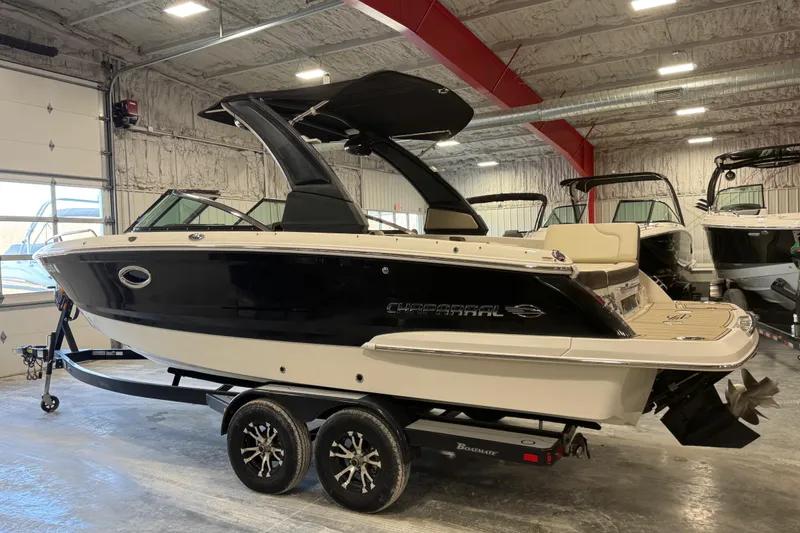 Slide: The Image of 2019 Chaparral 257 SSX boat on trailer in indoor showroom. - 3