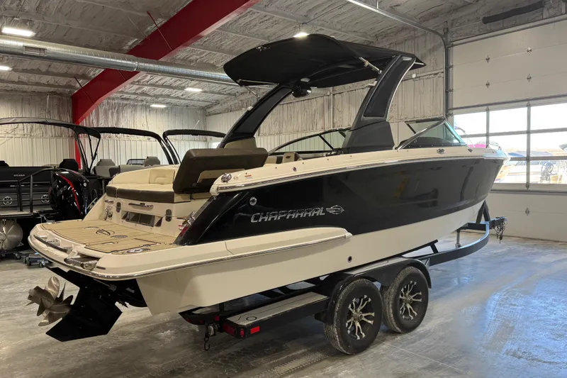 Slide: The Image of 2019 Chaparral 257 SSX boat on trailer in indoor showroom. - 4