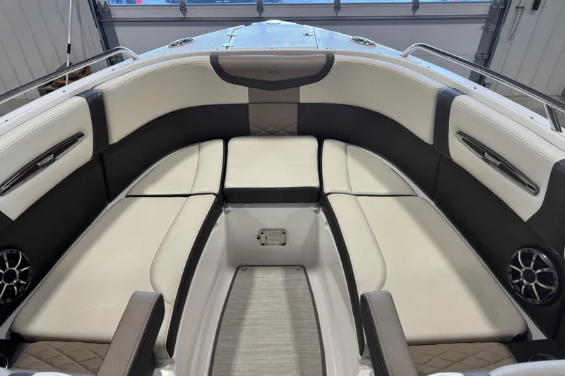 Slide: The Image of 2019 Chaparral 257 SSX boat interior with cushioned seating and modern design. - 6