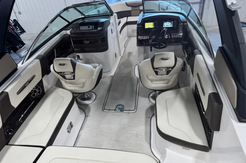 Slide: The Image of 2019 Chaparral 257 SSX boat interior with modern dashboard and seating. - 8
