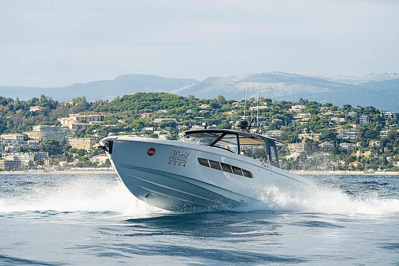 Slide: The Image of 2024 Wiszniewski Yachts W43 cruising on water with scenic coastal backdrop. - 3