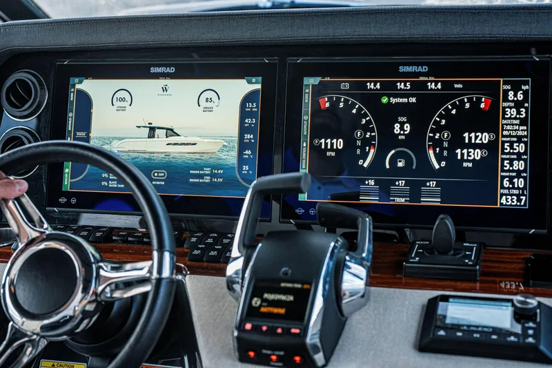 Slide: The Image of Cockpit of 2024 Wiszniewski Yachts W43 with advanced navigation displays and controls. - 11