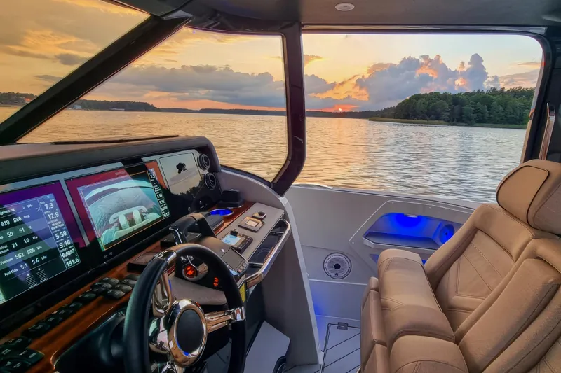 Slide: The Image of Luxurious 2024 Wiszniewski Yachts W43 helm with sunset view over serene waters. - 12