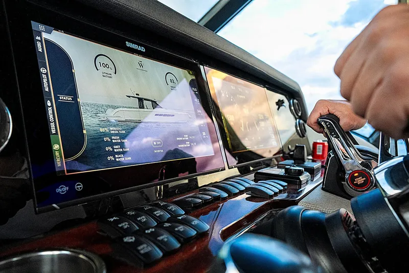 Slide: The Image of Cockpit of 2024 Wiszniewski Yachts W43 with advanced navigation displays and controls. - 13