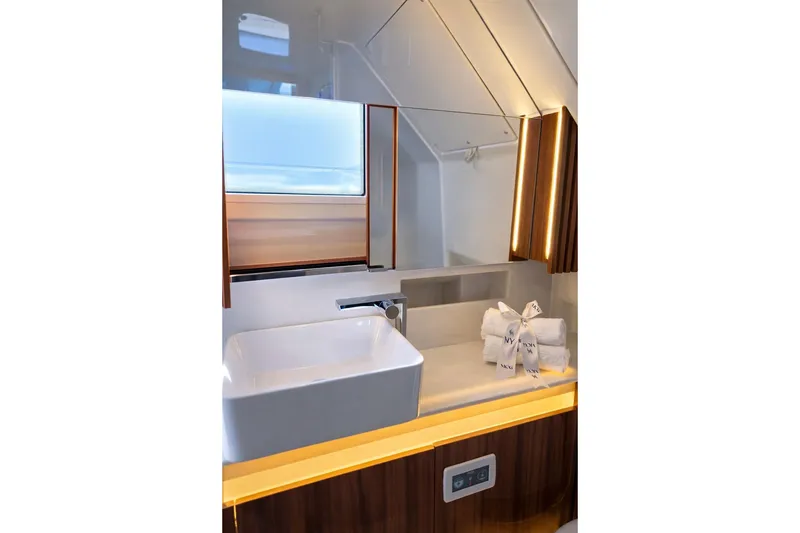 Slide: The Image of Luxurious bathroom in 2026 Wiszniewski Yachts W43, featuring modern sink and elegant lighting. - 12