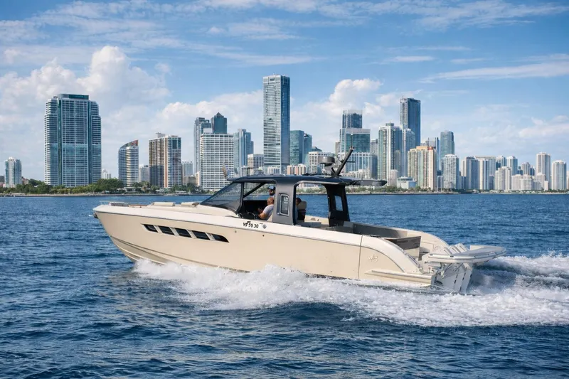 The Image of 2026 Wiszniewski Yachts W43 cruising near a city skyline on a sunny day. - 0