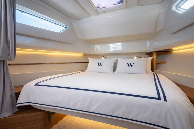 Slide: The Image of Luxurious cabin interior of 2026 Wiszniewski Yachts W43 with elegant bedding and ambient lighting. - 9