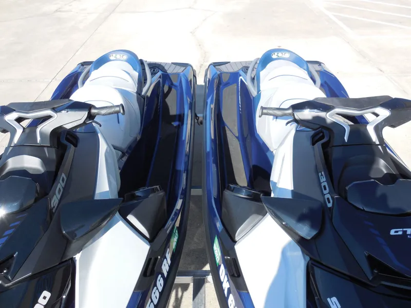 Slide: The Image of Two 2024 Sea-Doo GTX Limited 300 jet skis in blue and white. - 10