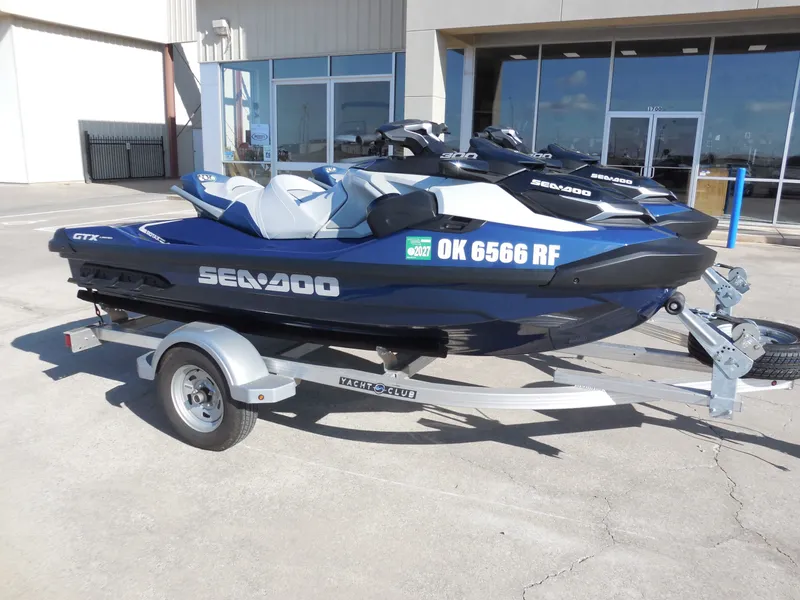 Slide: The Image of 2024 Sea-Doo GTX Limited 300 on trailer outside building. - 3