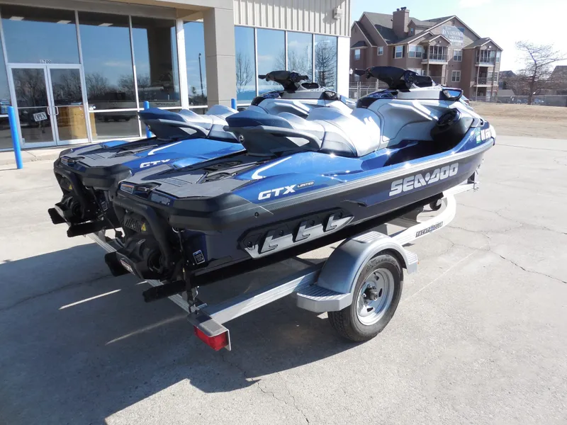 Slide: The Image of Two 2024 Sea-Doo GTX Limited 300 jet skis on trailer. - 4