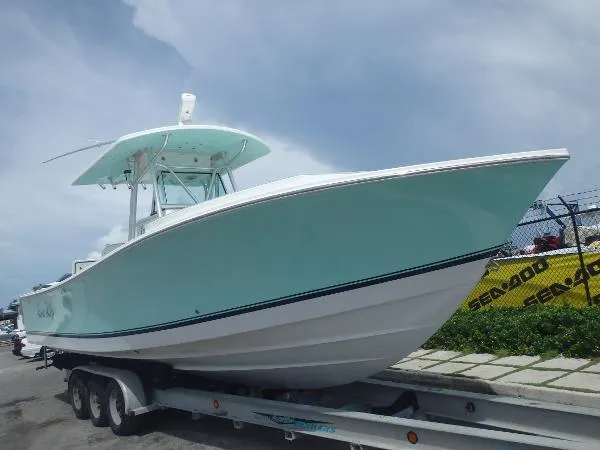 Slide: The Image of Regulator Marine 32 FS 2015 Evinrude G2's 2006 - 3