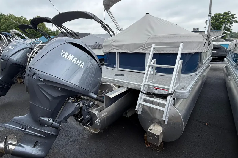 Slide: The Image of 2026 Godfrey EX2286SBX pontoon boat with Yamaha outboard motor and ladder. - 10