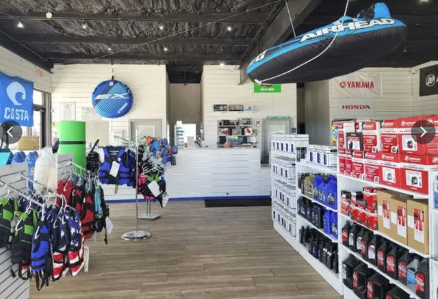 Slide: The Image of Interior of a watersports store featuring Yamaha WaveRunner accessories. - 11