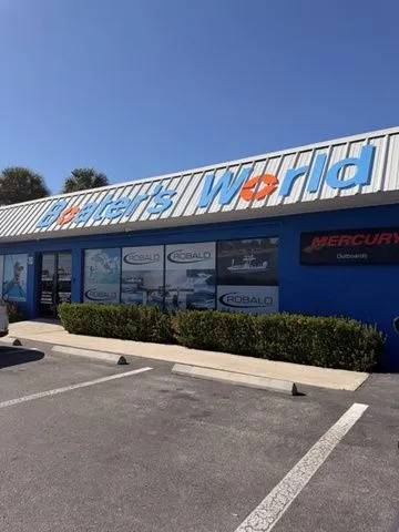 Slide: The Image of Exterior of a boat and watersports store under sunny skies. - 10