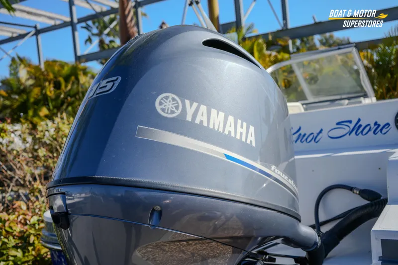 Slide: The Image of 2018 Starcraft MDX 190 O/B with Yamaha outboard motor in a sunny setting. - 11