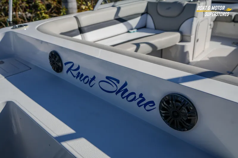 Slide: The Image of 2018 Starcraft MDX 190 O/B boat interior with "Knot Shore" text and speakers. - 14
