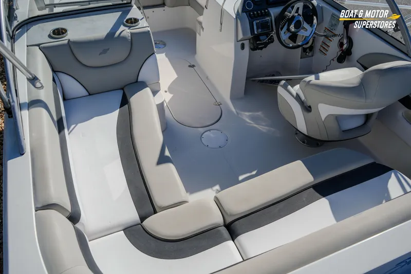 Slide: The Image of 2018 Starcraft MDX 190 O/B boat interior with seating and steering console. - 18