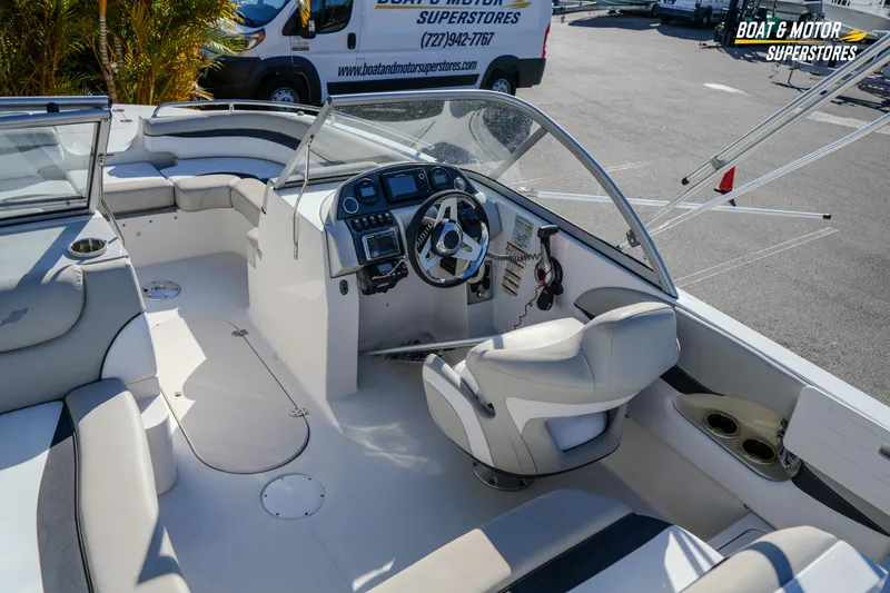 Slide: The Image of 2018 Starcraft MDX 190 O/B boat interior with steering console and seating. - 19