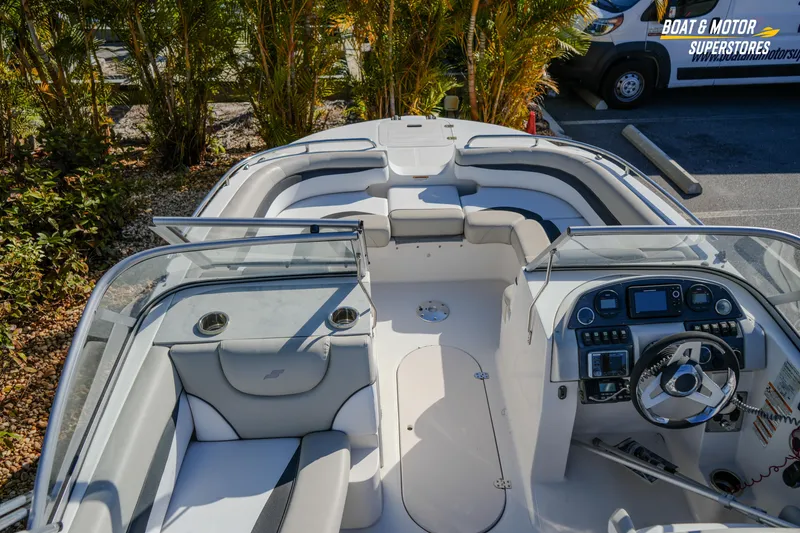 Slide: The Image of 2018 Starcraft MDX 190 O/B boat interior with seating and control panel. - 20