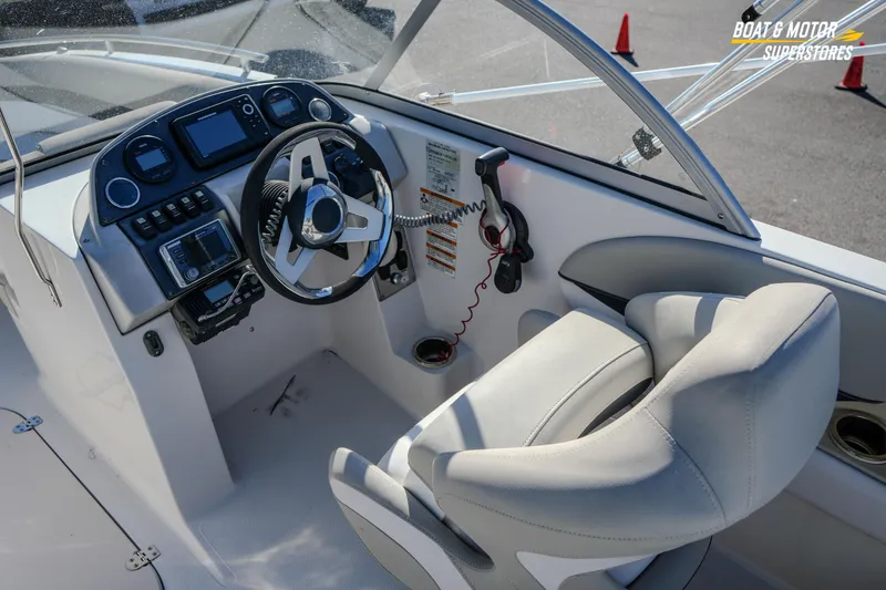 Slide: The Image of 2018 Starcraft MDX 190 O/B boat interior with steering wheel and control panel. - 22