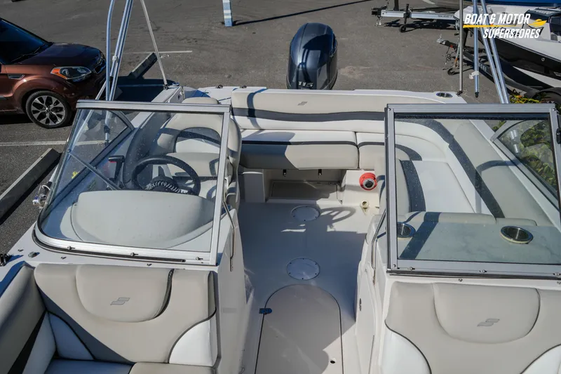 Slide: The Image of 2018 Starcraft MDX 190 O/B boat interior with seating and steering wheel. - 31
