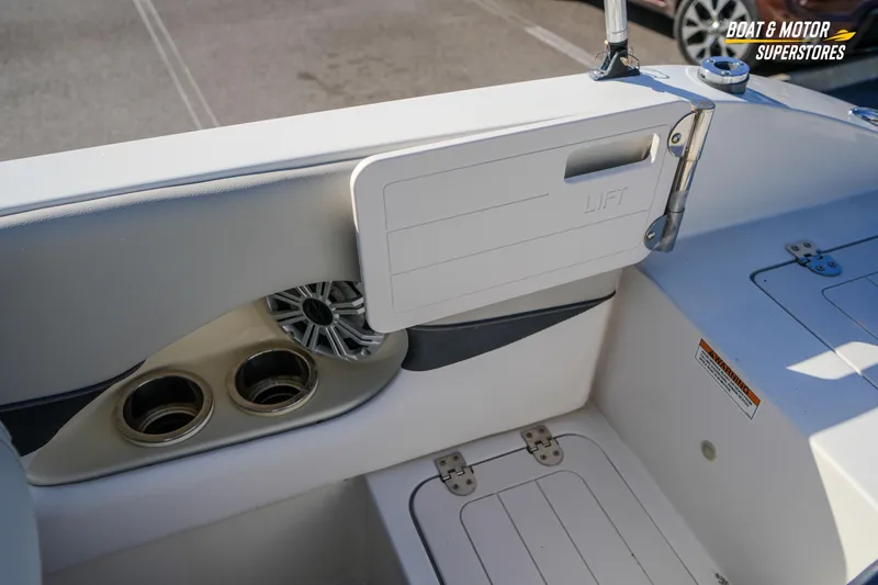 Slide: The Image of 2018 Starcraft MDX 190 O/B boat interior with cup holders and speaker. - 34