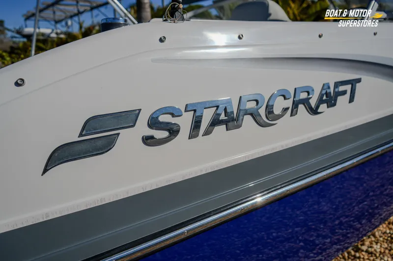 Slide: The Image of 2018 Starcraft MDX 190 O/B boat side view with logo detail. - 8