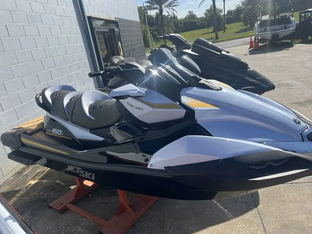 Slide: The Image of 2026 Kawasaki Jet Ski Ultra 160 parked in sunlight. - 3